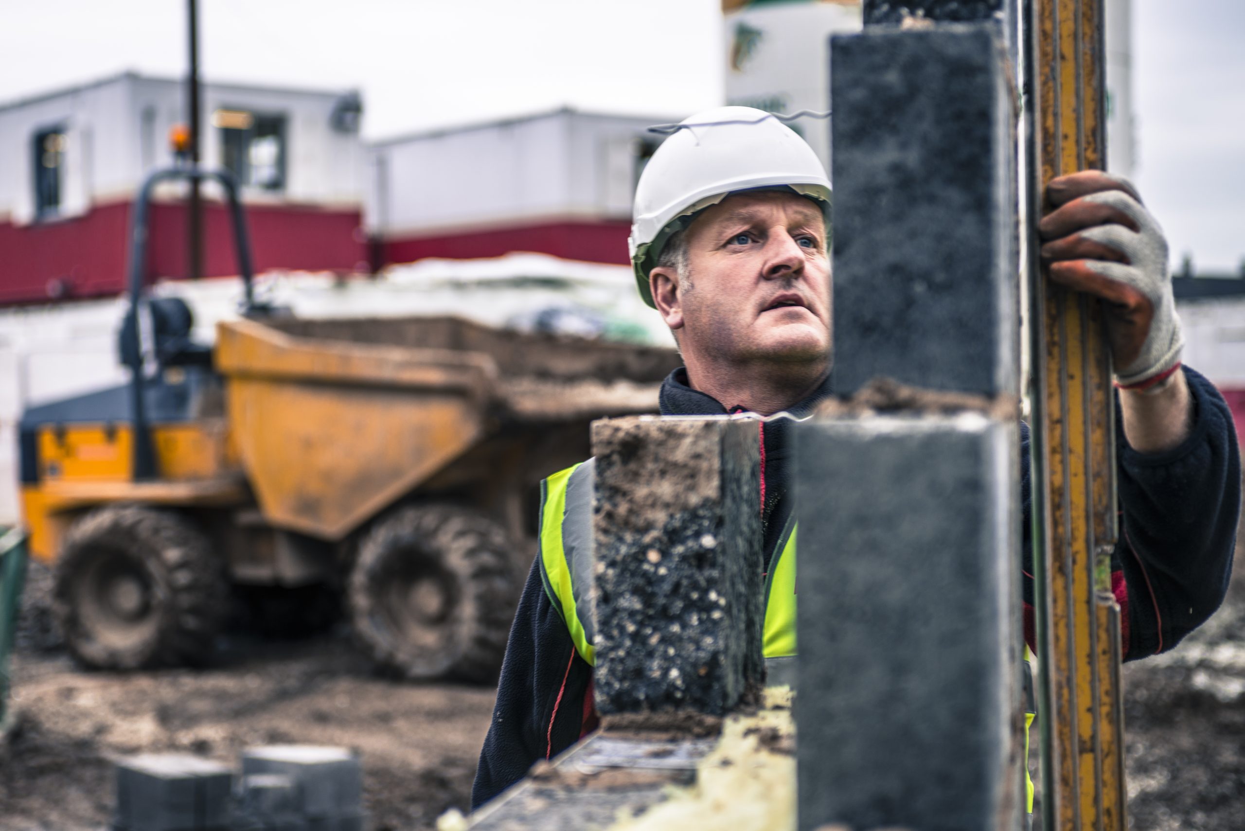 Self Employed / Contractor laying bricks on construction site